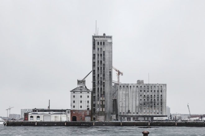 the Silo by COBE, The Silo Nordhavn, The Silo apartments, repurposed silo architecture, galvanized steel facade, adaptive reuse apartments, Nordhavn apartments, adaptive reuse silo