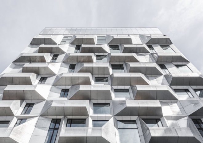 the Silo by COBE, The Silo Nordhavn, The Silo apartments, repurposed silo architecture, galvanized steel facade, adaptive reuse apartments, Nordhavn apartments, adaptive reuse silo