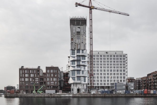 the Silo by COBE, The Silo Nordhavn, The Silo apartments, repurposed silo architecture, galvanized steel facade, adaptive reuse apartments, Nordhavn apartments, adaptive reuse silo
