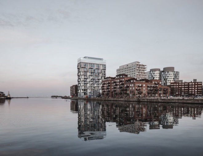 the Silo by COBE, The Silo Nordhavn, The Silo apartments, repurposed silo architecture, galvanized steel facade, adaptive reuse apartments, Nordhavn apartments, adaptive reuse silo