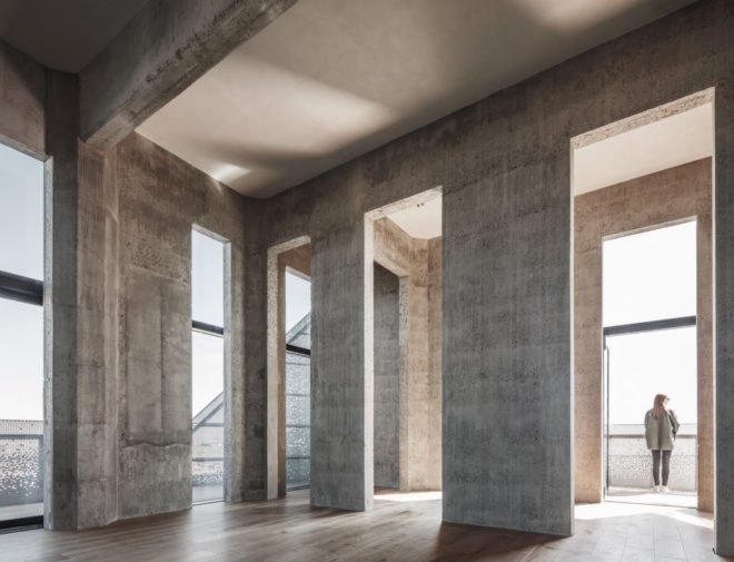 the Silo by COBE, The Silo Nordhavn, The Silo apartments, repurposed silo architecture, galvanized steel facade, adaptive reuse apartments, Nordhavn apartments, adaptive reuse silo