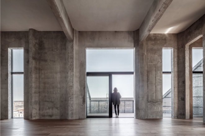 the Silo by COBE, The Silo Nordhavn, The Silo apartments, repurposed silo architecture, galvanized steel facade, adaptive reuse apartments, Nordhavn apartments, adaptive reuse silo