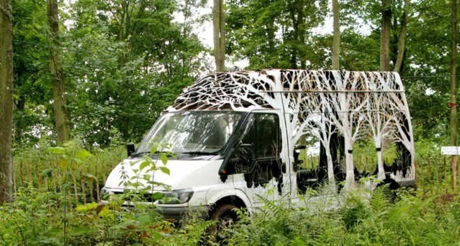 Dan Rawlings, Nature Delivers, art, van art, nature-inspired art, forest art, street sign art, urban art, vehicle art, Lost Eden festival, metal sculpture, art sculpture, metal cutting art, repurposed vans, urban artists, graffiti art,