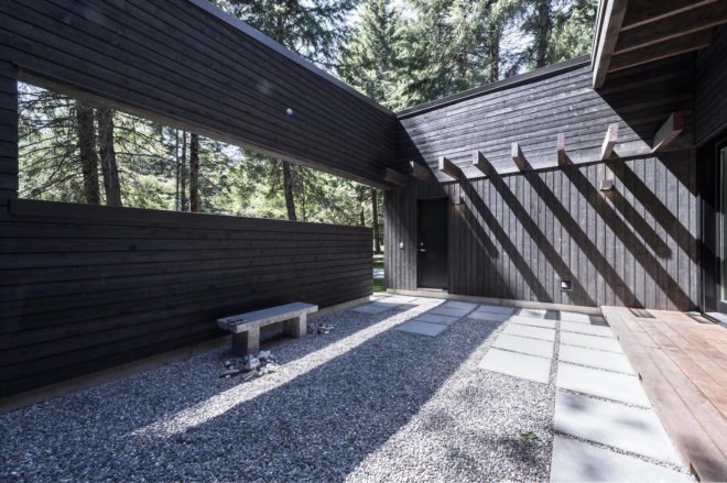 Courtyard House on a River by Robert Hutchison Architecture, Greenwater modern architecture, small home living movement, western red cedar clad home, Seattle retreat, zen like retreat,