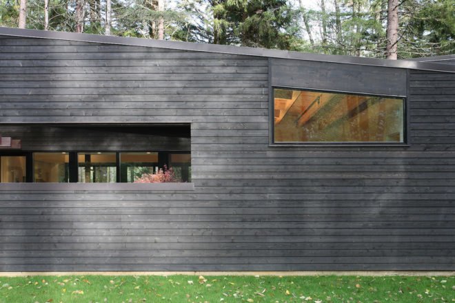 Courtyard House on a River by Robert Hutchison Architecture, Greenwater modern architecture, small home living movement, western red cedar clad home, Seattle retreat, zen like retreat,