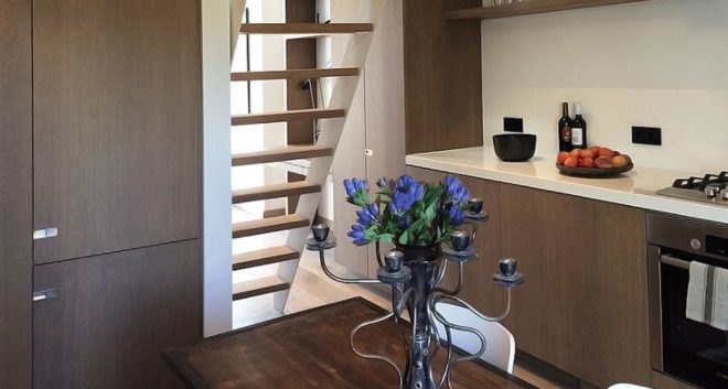 Deirdre Renniers, interior renovation, Amsterdam, space-saving furniture, green interior, open-plan layout, timber, flexible spaces