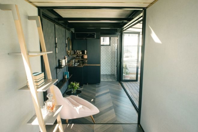 Contained, shipping containers, Shipping Container Hotel, portable shipping container hotel, shipping container building, shipping container designs, eco-friendly hotels, sustainable hotels, green hotels, moveable hotels, transportable hotels, shipping container buildings, reclaimed wood, sustainable building materials,