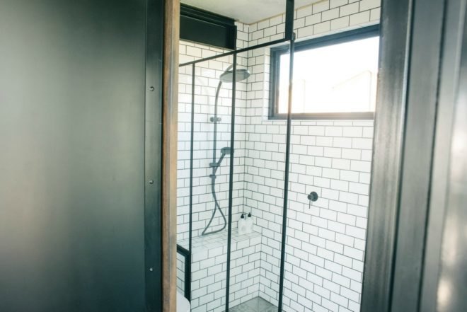 Contained, shipping containers, Shipping Container Hotel, portable shipping container hotel, shipping container building, shipping container designs, eco-friendly hotels, sustainable hotels, green hotels, moveable hotels, transportable hotels, shipping container buildings, reclaimed wood, sustainable building materials,