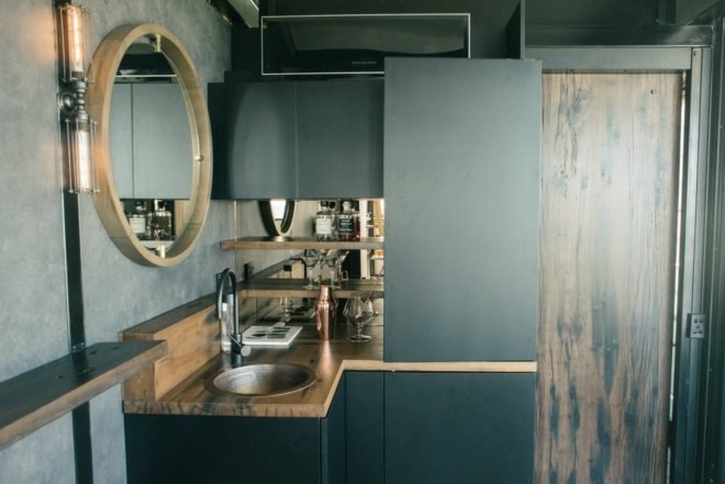 Contained, shipping containers, Shipping Container Hotel, portable shipping container hotel, shipping container building, shipping container designs, eco-friendly hotels, sustainable hotels, green hotels, moveable hotels, transportable hotels, shipping container buildings, reclaimed wood, sustainable building materials,