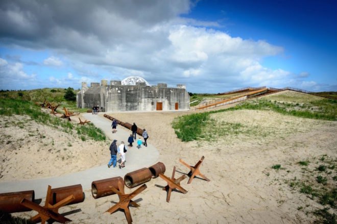 TIRPITZ by BIG, TIRPITZ by Tinker Imagineers, TIRPITZ by Varde Museums, TIRPITZ museum, TIRPITZ architecture, bunker museum, Blåvand museum, bunker adaptive reuse, war museum design, invisible museum
