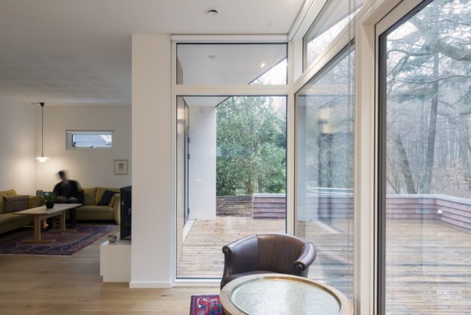 Villa Rypen by C.F. Moller, Aarhus modern home, Villa Rypen Aarhus, terra-cotta tilec screen facade, flexible interior layout for home, sliding doors interior design,