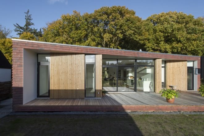 Villa Rypen by C.F. Moller, Aarhus modern home, Villa Rypen Aarhus, terra-cotta tilec screen facade, flexible interior layout for home, sliding doors interior design,