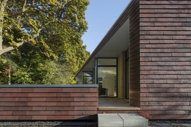 Villa Rypen by C.F. Moller, Aarhus modern home, Villa Rypen Aarhus, terra-cotta tilec screen facade, flexible interior layout for home, sliding doors interior design,