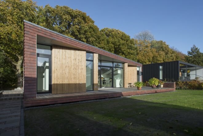 Villa Rypen by C.F. Moller, Aarhus modern home, Villa Rypen Aarhus, terra-cotta tilec screen facade, flexible interior layout for home, sliding doors interior design,