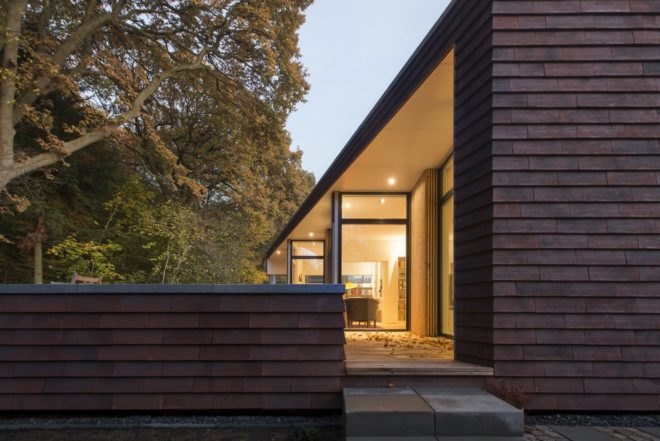 Villa Rypen by C.F. Moller, Aarhus modern home, Villa Rypen Aarhus, terra-cotta tilec screen facade, flexible interior layout for home, sliding doors interior design,