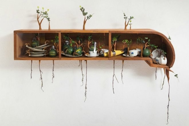 Camille Kachan, Sao Paulo’s Zipper Galeria, brazilian art, tree art, nature-inspired art, furniture covered in plants, overgrown plant art, art installations, green art, brazilian artists, plant art, sculpture, plant covered art, green artists,