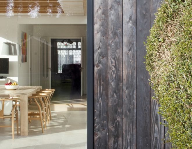 Copeland Grove by Stephen Kavanagh Architects, charred timber house extension, modern house extension, Copeland Grove in Dublin, timber and glass house box,