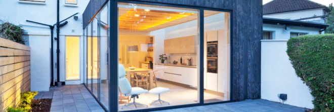 Copeland Grove by Stephen Kavanagh Architects, charred timber house extension, modern house extension, Copeland Grove in Dublin, timber and glass house box,