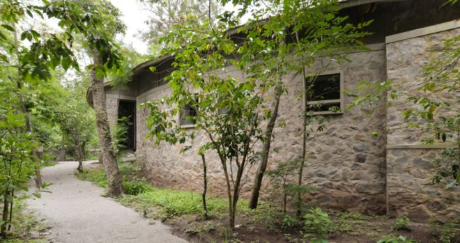 Casa Amacueca, CoA arquitectura, Departamento de Arquitectura, timber, stone, retreat, Mexico, concrete, wooden walkway, gable roof, natural light, courtyard