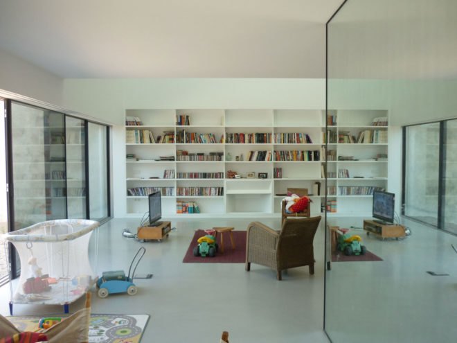 Red House by Extrastudio, Red House in Azeitao, winery transformed into home, adaptive reuse winery, Portugal adaptive reuse, contemporary architecture Portugal, minimalist and modern Portugal interior design, black glass sliding doors,