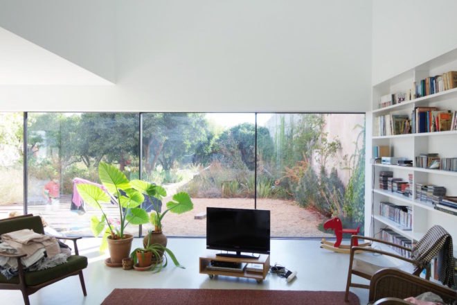 Red House by Extrastudio, Red House in Azeitao, winery transformed into home, adaptive reuse winery, Portugal adaptive reuse, contemporary architecture Portugal, minimalist and modern Portugal interior design, black glass sliding doors,