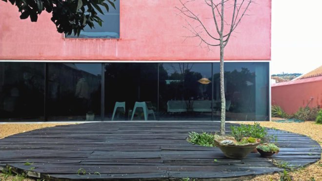Red House by Extrastudio, Red House in Azeitao, winery transformed into home, adaptive reuse winery, Portugal adaptive reuse, contemporary architecture Portugal, minimalist and modern Portugal interior design, black glass sliding doors,