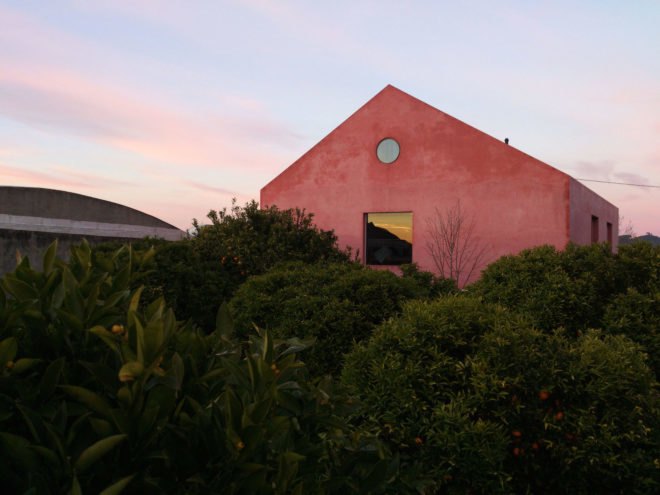 Red House by Extrastudio, Red House in Azeitao, winery transformed into home, adaptive reuse winery, Portugal adaptive reuse, contemporary architecture Portugal, minimalist and modern Portugal interior design, black glass sliding doors,