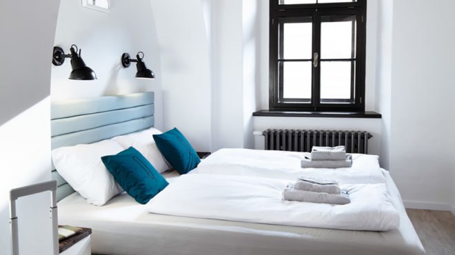 Denisa Strmiskova Studio, Long Story Short Hostel, green renovation, historic building, Czech Republic, modernist furniture, vaulted ceiling, green interior, local craftsmen, natural materials