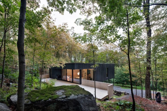 The Rock by Atelier General, The Rock house Quebec, Quebec forest cabin, black painted timber home, black painted timber architecture, Canada forest architecture,