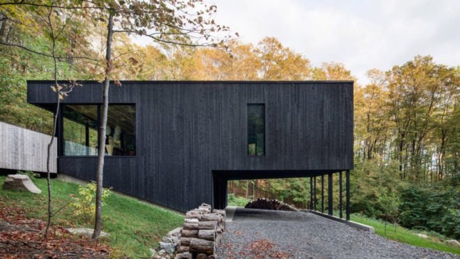 The Rock by Atelier General, The Rock house Quebec, Quebec forest cabin, black painted timber home, black painted timber architecture, Canada forest architecture,
