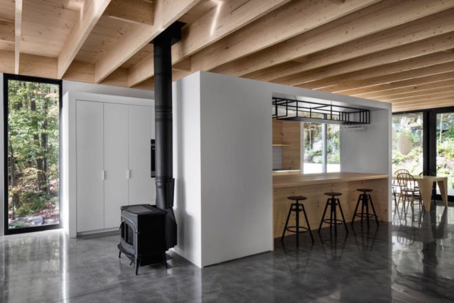 The Rock by Atelier General, The Rock house Quebec, Quebec forest cabin, black painted timber home, black painted timber architecture, Canada forest architecture,