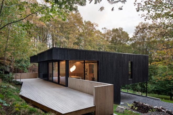 The Rock by Atelier General, The Rock house Quebec, Quebec forest cabin, black painted timber home, black painted timber architecture, Canada forest architecture,