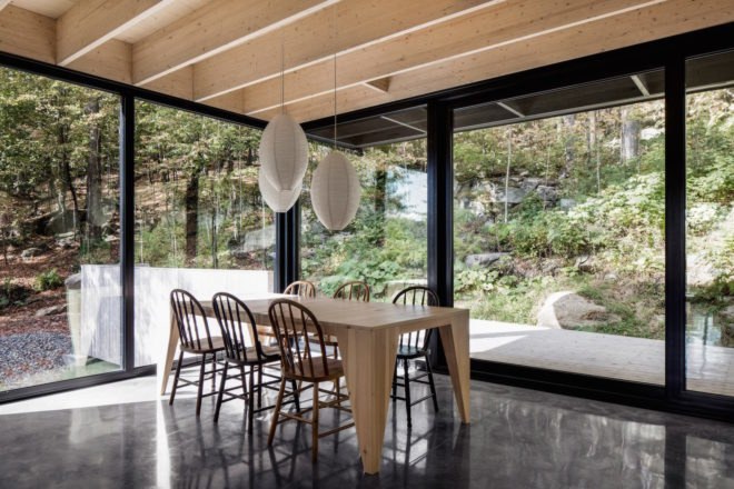The Rock by Atelier General, The Rock house Quebec, Quebec forest cabin, black painted timber home, black painted timber architecture, Canada forest architecture,