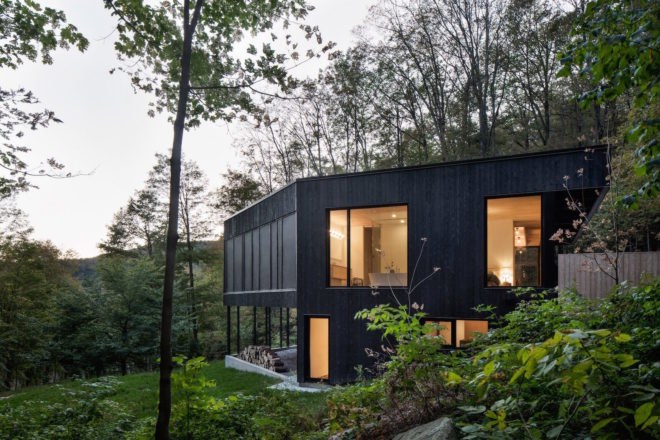 The Rock by Atelier General, The Rock house Quebec, Quebec forest cabin, black painted timber home, black painted timber architecture, Canada forest architecture,