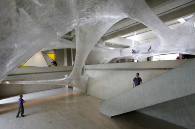 Suspended Tape Structure, Numen/For Use, Tape Art Installation, Des Moines Art Center, Drawing in Space, spider art, hanging art, tape art des moines, art installation, interactive art installation, tape art installation, tape art, tape structures, human scale spider web, spider web art