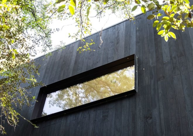 Treehouse, Texas, PH2 Treebox, Wernerfield, guest house, Dallas, elevated house, charred wood, green architecture, staircase, burnt wood