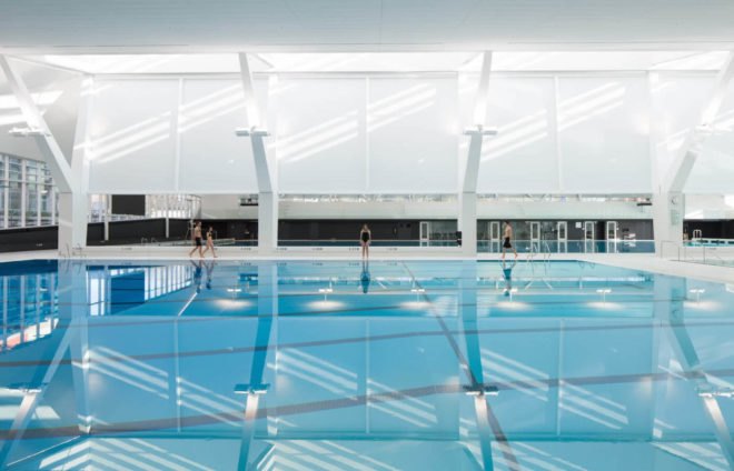 UBC Aquatic Center by MJMA, UBC Aquatic Center LEED Gold, LEED Gold aquatic center, LEED swimming center, University of British Columbia aquatics center, sustainable swimming facility, sustainable water reuse for pools, rainwater collection ad reuse for aquatics center