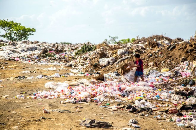 A landfill is filled with garbage.