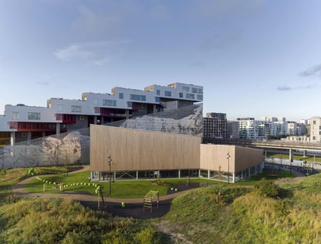 Ørestad City sports center by NORD Architects, Ørestad City sports facility, Ørestad City new architecture, green roofed sports center, timber clad architecture in Ørestad City, contemporary timber public architecture, Copenhagen sports center,