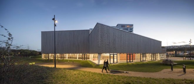 Ørestad City sports center by NORD Architects, Ørestad City sports facility, Ørestad City new architecture, green roofed sports center, timber clad architecture in Ørestad City, contemporary timber public architecture, Copenhagen sports center,