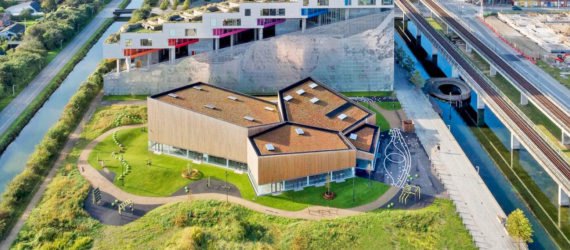 Ørestad City sports center by NORD Architects, Ørestad City sports facility, Ørestad City new architecture, green roofed sports center, timber clad architecture in Ørestad City, contemporary timber public architecture, Copenhagen sports center,