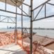 The Hudson River can be glimpsed from 40 Tenth Avenue, designed by Studio Gang, in New York City