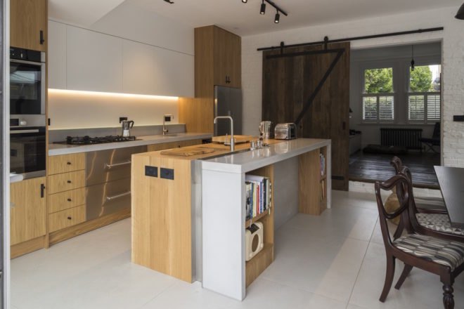 The kitchen features natural oak countertops
