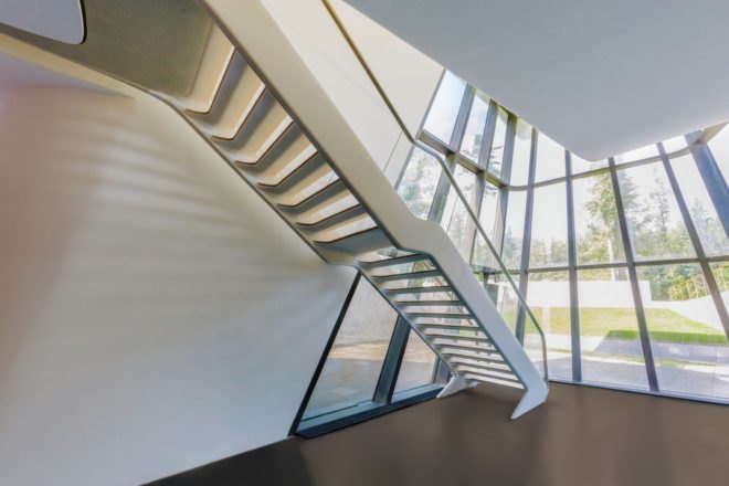 A futuristic, white set of stairs inside the tower lead to the top.