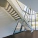 A futuristic, white set of stairs inside the tower lead to the top.