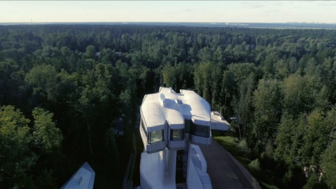 Image of the home, which is surrounded by miles of trees.