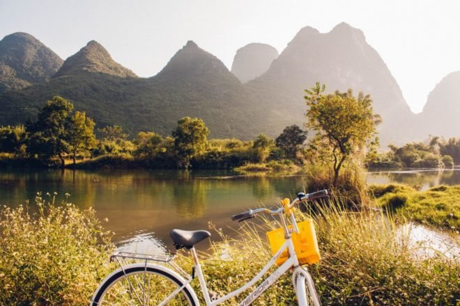 A mountain, lake, and bicycle in the city of Guilin in southern China