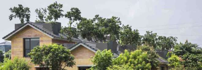Dong Anh House by Vo Trong Nghia Architects, Dong Anh House in Hanoi, Dong Anh House in Vietnam, rammed earth modern architecture, rammed earth architecture in Hanoi, rammed earth housing in Vietnam, contemporary rammed earth house, fruit trees on a roof,