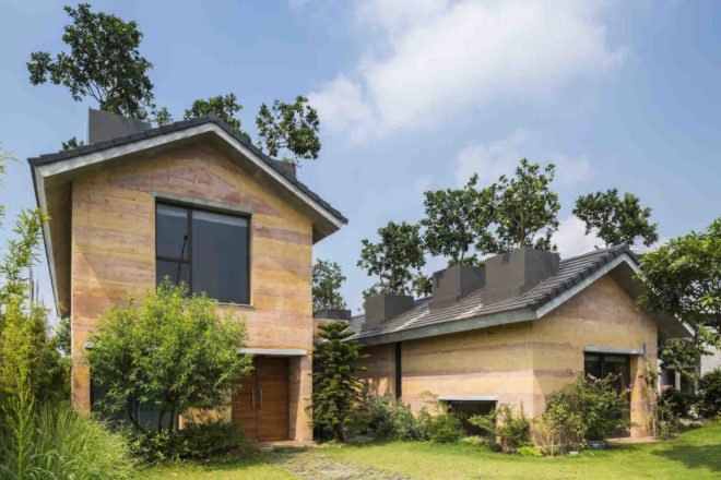 Dong Anh House by Vo Trong Nghia Architects, Dong Anh House in Hanoi, Dong Anh House in Vietnam, rammed earth modern architecture, rammed earth architecture in Hanoi, rammed earth housing in Vietnam, contemporary rammed earth house, fruit trees on a roof,