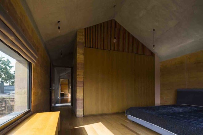 Dong Anh House by Vo Trong Nghia Architects, Dong Anh House in Hanoi, Dong Anh House in Vietnam, rammed earth modern architecture, rammed earth architecture in Hanoi, rammed earth housing in Vietnam, contemporary rammed earth house, fruit trees on a roof,
